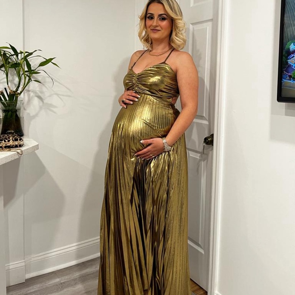 Gold shiny long dress . Worn only 1 time in a wedding